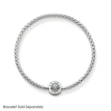 Silver charm featuring an ornate circular design, shown on a delicate chain bracelet (bracelet sold separately).
