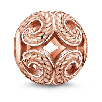 Rose gold Karma Bead Wave charm with intricate detailing
