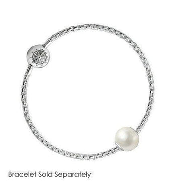 White pearl and silver charm on a delicate chain.

