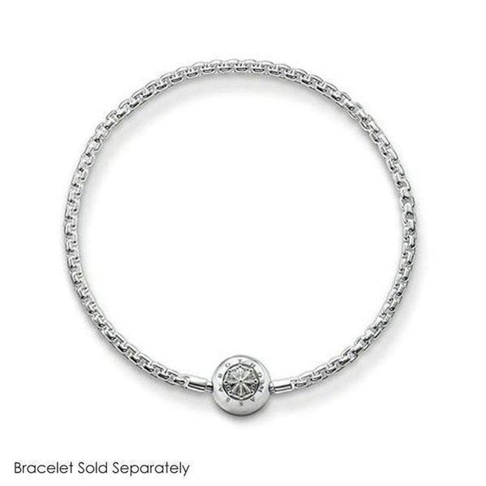 Silver charm featuring an ornate, circular design, shown on a silver chain bracelet (bracelet sold separately).
