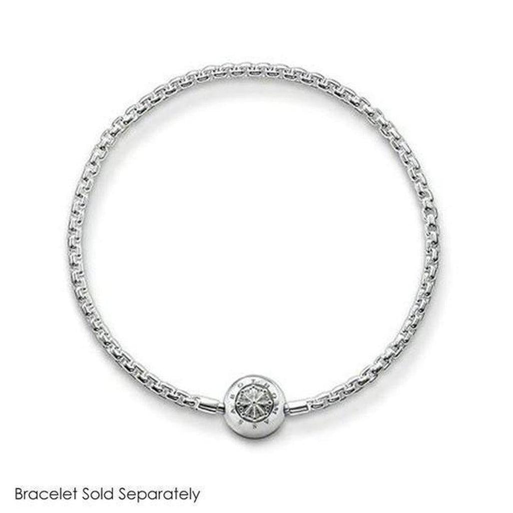 Silver charm featuring an ornate, circular design, shown on a silver chain bracelet (bracelet sold separately).
