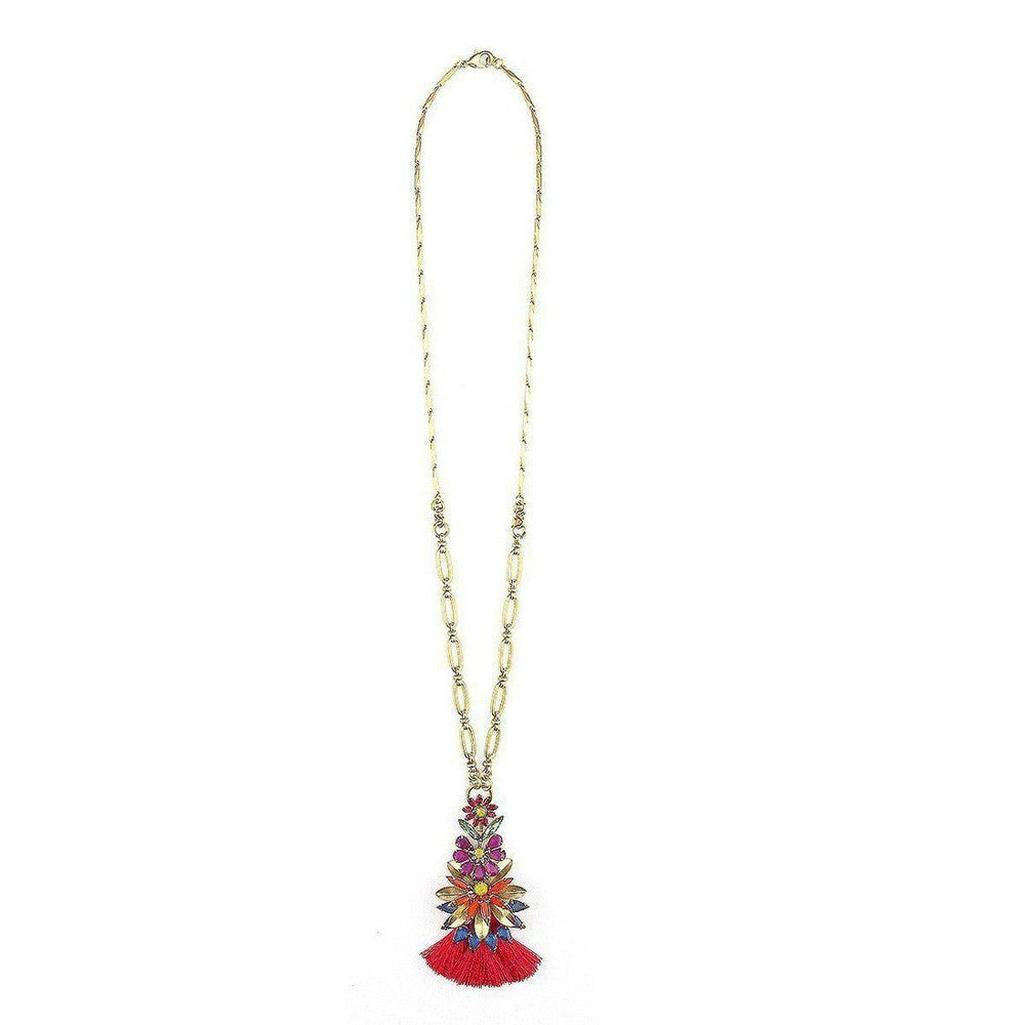 Gold chain necklace with colorful floral pendant and red tassel.
