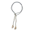 Klara Pearl Lariat necklace: Grey crystal beaded lariat with gold accents and baroque pearls.
