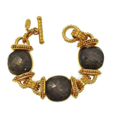 Labradorite three-stone bracelet with gold-tone metal accents.
