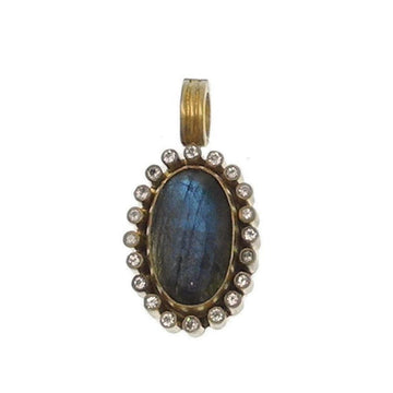 Labradorite necklace enhancer: Oval blue labradorite gemstone framed by shimmering diamonds, gold setting.
