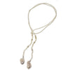 Elegant lariat necklace featuring baroque pearls and crystal beads; perfect for adding a touch of sophistication to any outfit.
