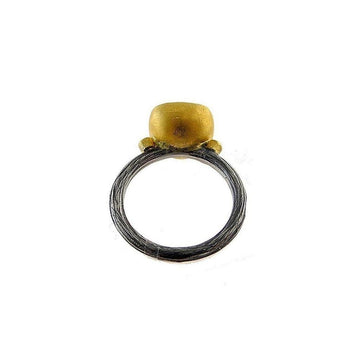 Gold and oxidized silver ring featuring a lemon quartz gemstone.
