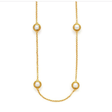 Gold chain necklace featuring three pearl accents.
