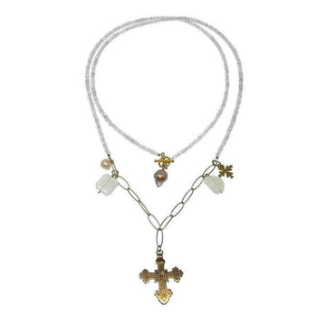 Layered beaded necklace with a gold cross pendant and pearl accents.
