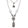 Love Heals Audrey necklace: Silver filigree, heart charm, & white stone beads.
