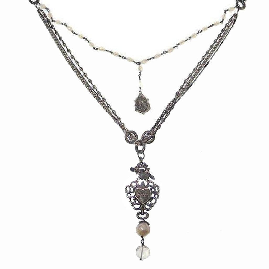 Love Heals Valeria necklace: layered chain, pearl accents, heart charm, antique silver finish.
