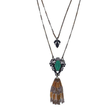 Lucid Tassel Necklace: Double-strand necklace with green stone, gold tassel, and black accents.
