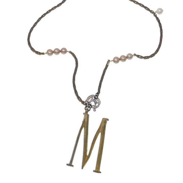 Lulu Frost Plaza Letter M Necklace: gold initial M pendant with bronze chain and blush pearls.
