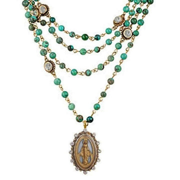 Multi-strand turquoise and gold necklace featuring a Madonna medallion.
