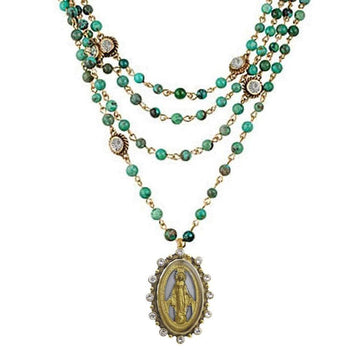 Multi-strand turquoise bead necklace with gold accents and a detailed Virgin Mary pendant.
