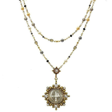 Elegant double-strand pearl rosary necklace with ornate gold medallion.
