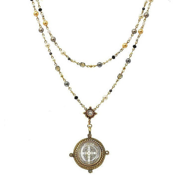 Elegant double-strand pearl rosary necklace with a detailed medallion pendant.

