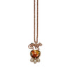 Mawi Leopard necklace: Rose gold chain, jeweled leopard pendant, heart-shaped gemstone, and pearl accents.
