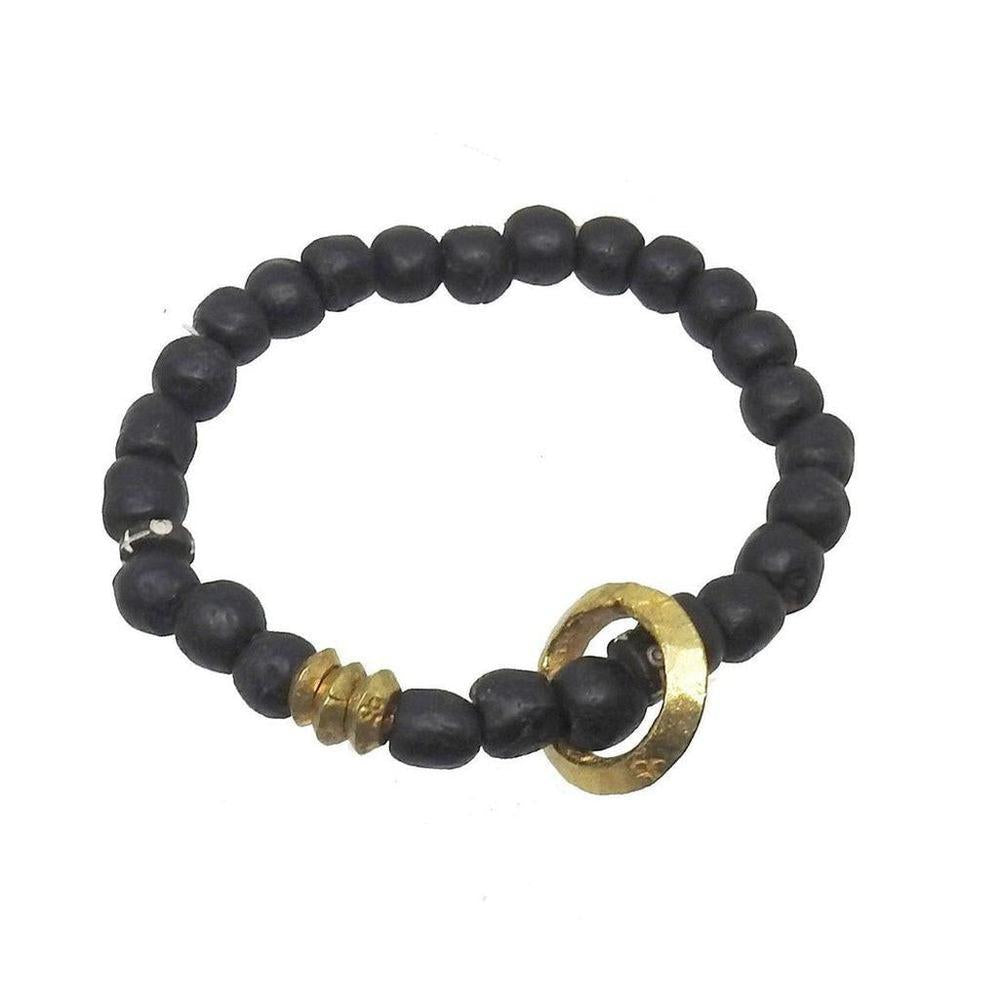 Black beaded meditation bracelet with gold accent, perfect for mindfulness.
