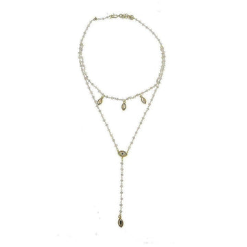 Delicate layered necklace featuring an evil eye charm and rose quartz beads.
