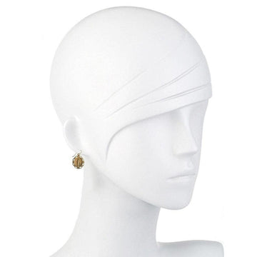 Gold oval earrings on a mannequin, showcasing delicate detail.
