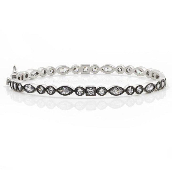 Silver mixed shape bangle featuring marquise, round, and square-cut cubic zirconia stones.
