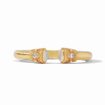 Gold cuff bracelet featuring etched gemstone accents and marquise-cut stones.
