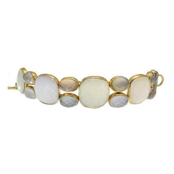 Gold bracelet featuring large moonstone and smaller gemstone accents.

