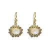 Elegant Moonstone Earrings in 18k gold, featuring a halo of shimmering diamonds.
