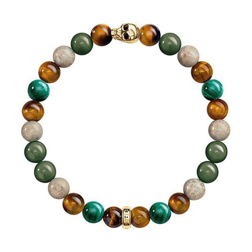 Multi-stone bracelet with tiger eye, malachite, and fossilized wood beads; gold skull and spacer beads.
