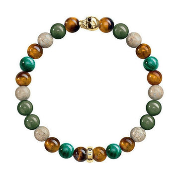 Multi-stone bracelet with tiger eye, malachite, and fossilized wood beads; gold skull and spacer beads.
