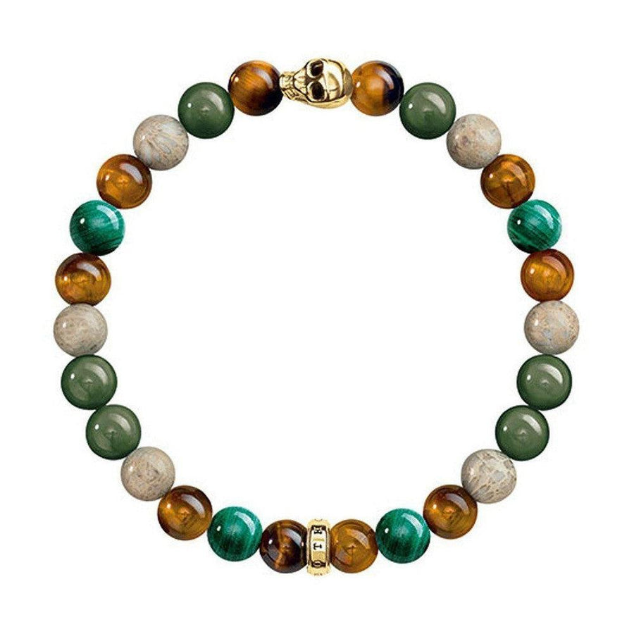 Multi-stone bracelet with tiger eye, malachite, and fossilized wood beads; gold skull and spacer beads.
