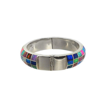 Multicolored opal inlay cuff bracelet with hinged silver clasp.
