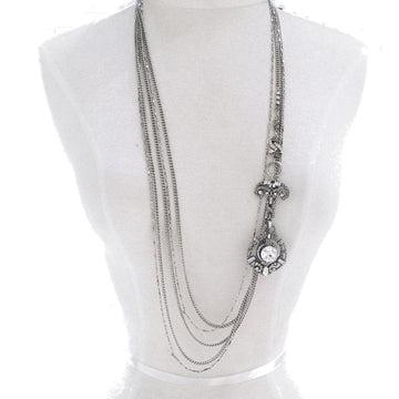Silver multi-strand necklace with long, dangling cabochon pendant.

