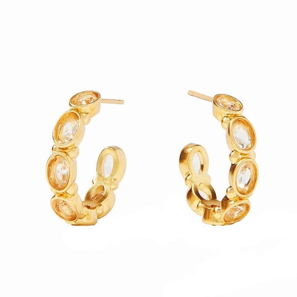 Gold Mykonos hoop earrings with sparkling clear stones.
