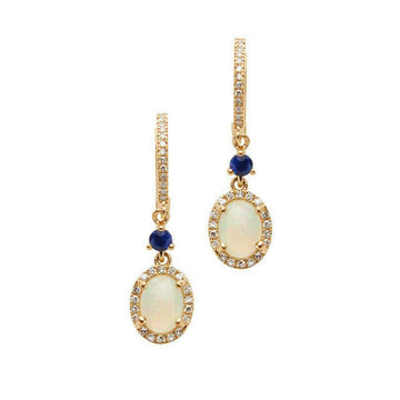 Elegant gold huggie earrings featuring opal and sapphire accents.
