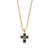 Gold ball chain necklace with black enamel cross charm and clear cubic zirconia accents.
