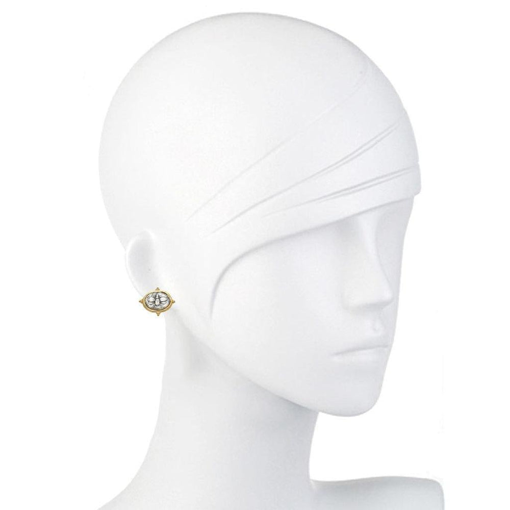Gold oval earrings featuring an engraved bee design, shown on a mannequin.
