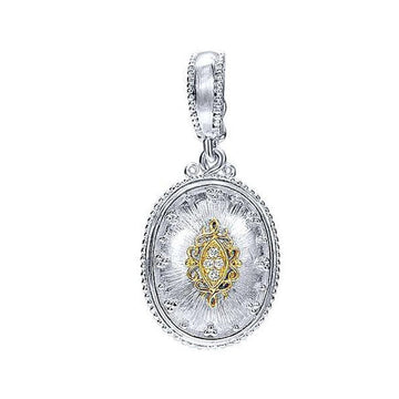 Silver oval diamond pendant necklace with gold detailing.
