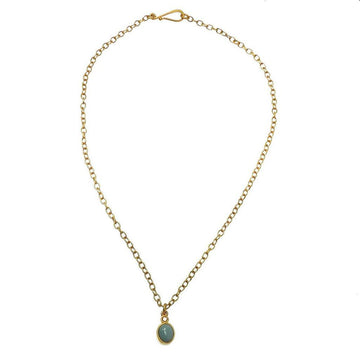Dainty gold chain necklace featuring a small oval turquoise pendant.
