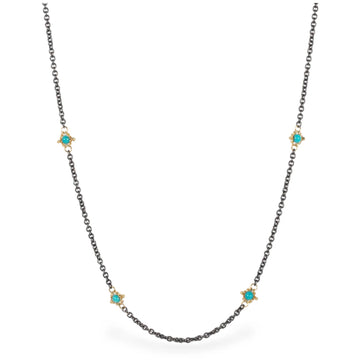 36-inch oxidized sterling silver chain featuring stationed turquoise stones set in 18k gold accents.
