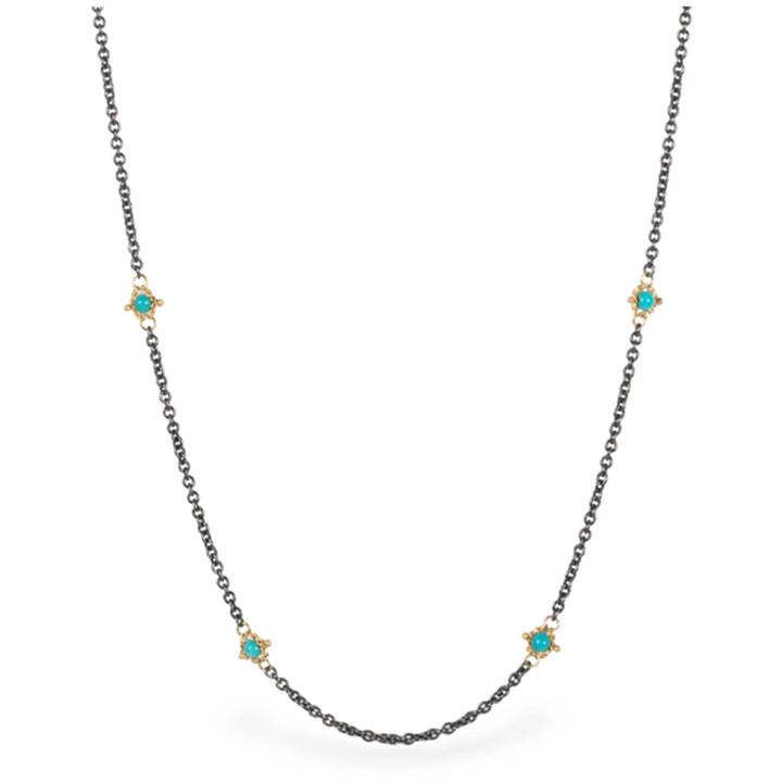 36-inch oxidized sterling silver chain featuring stationed turquoise stones set in 18k gold accents.