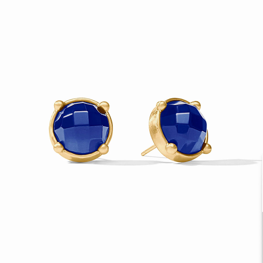 Honey stud earrings featuring round, faceted blue crystals in 24K gold-plated bezel settings with post closures.