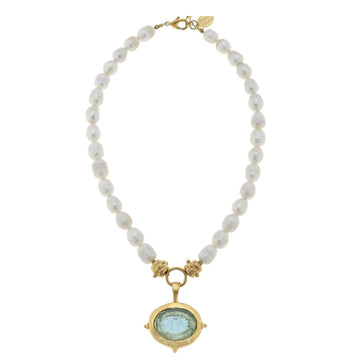 Aqua Venetian glass bee intaglio pendant on a 15-inch freshwater pearl necklace with gold-plated accents.