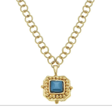 24k gold-plated London pendant necklace featuring a square blue crystal and textured gold link chain.