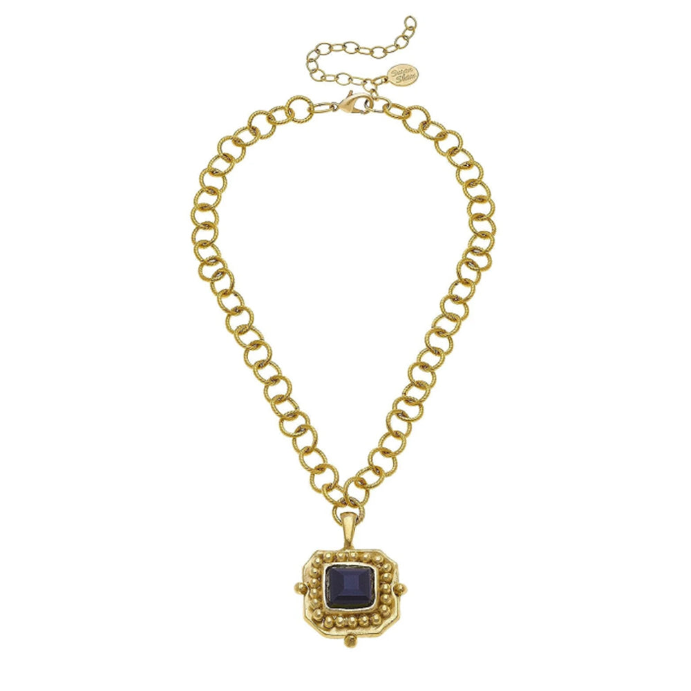 London pendant necklace featuring a square blue crystal in 24k gold-plated setting on a textured gold link chain.