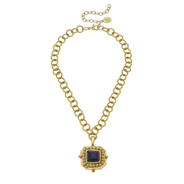 London pendant necklace featuring a square blue crystal in 24k gold-plated setting on a textured gold link chain.