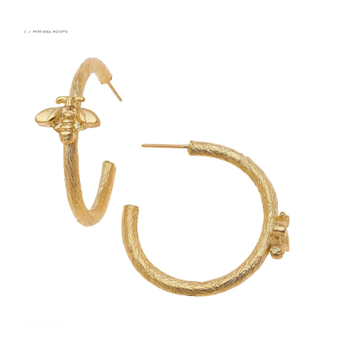 1 1/4 inch triple-plated 24k gold hoop earrings featuring a textured finish and a small bee charm with post backs.