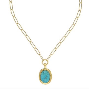 Oval turquoise cabochon pendant in a gold bezel setting on a gold paper clip chain necklace.
