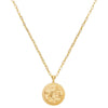 Gold Asian coin pendant necklace with detailed etched design.
